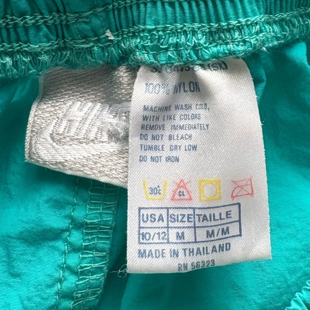 Nike women’s teal nylon short size medium.